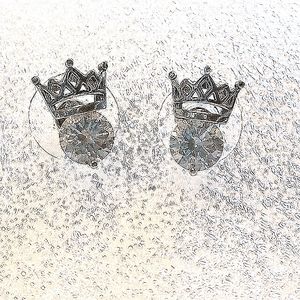 Sterling silver crown cubic zirconia post earrings.